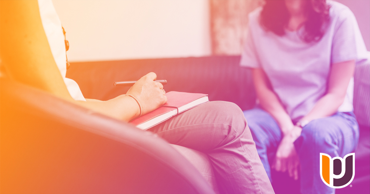 woman sitting with a counselor