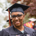 woman with cap and gown and glasses