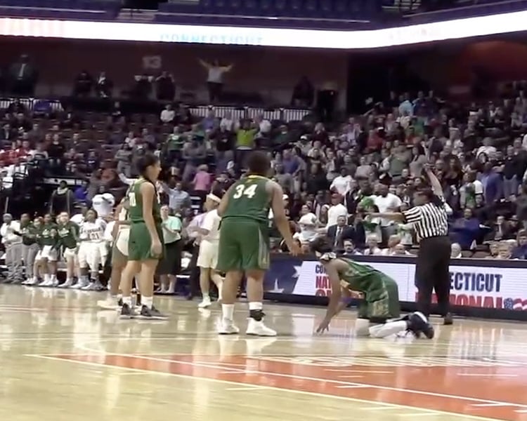 Tai Pagan and her teammates playing during a championship basketball game