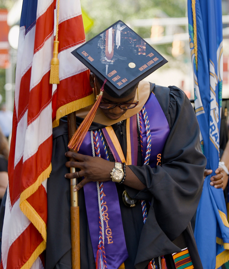 Jerrod Pass showing   his Graduation Cap customization